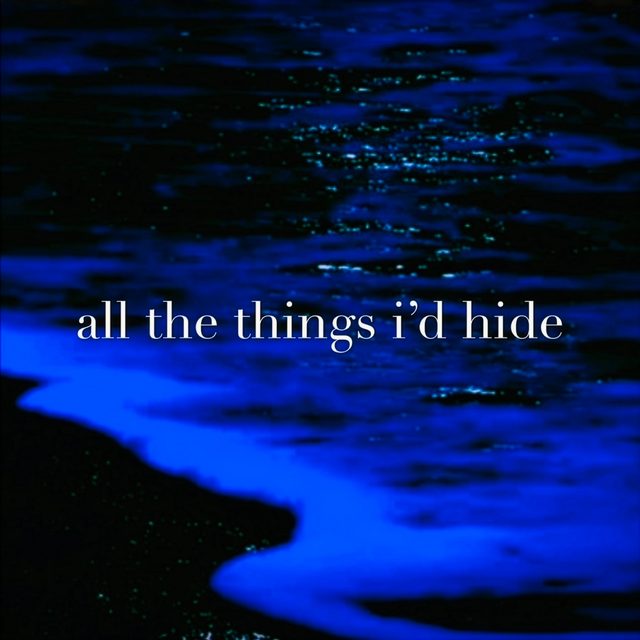 all the things i&rsquo;d hide &mdash; bioluminescent blue water breaking against a dark shore